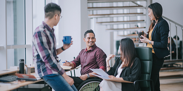 Employees discussing in the office setting